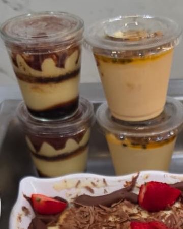 Individual dessert cups with layered cream and chocolate