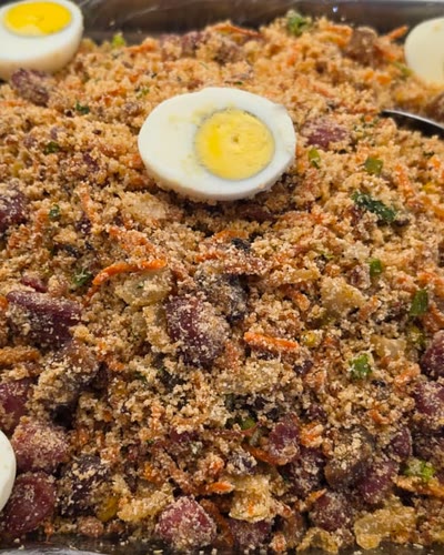 Tray of feijão tropeiro: beans and toasted cassava flour topped with boiled eggs